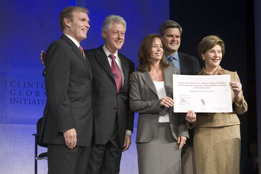 Mrs. Laura Bush announces a $60 million public-private partnership between the U.S. Government and the Case Foundation at President Bill Clinton's Annual Global Initiative Conference in New York Wednesday, September 20, 2006. With her, from left, are: Raymond Chambers, Chairman, MCJ and Amelier Foundations; former President Bill Clinton, and Jean Case and Steve Case, founders of the Case Foundation. The partnership will work to provide clean water by 2010 to up to 10 million people in sub-Sahara Africa, where a child dies every 15 seconds due to illnesses related to unsanitary drinking water. White House photo by Shealah Craighead