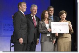 Mrs. Laura Bush announces a $60 million public-private partnership between the U.S. Government and the Case Foundation at President Bill Clinton's Annual Global Initiative Conference in New York Wednesday, September 20, 2006. With her, from left, are: Raymond Chambers, Chairman, MCJ and Amelier Foundations; former President Bill Clinton, and Jean Case and Steve Case, founders of the Case Foundation. The partnership will work to provide clean water by 2010 to up to 10 million people in sub-Sahara Africa, where a child dies every 15 seconds due to illnesses related to unsanitary drinking water.  White House photo by Shealah Craighead