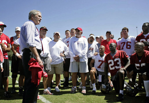 President George W. Bush talks with members of the Tampa Bay Buccaneers during his visit to the NFL team's training facility in Tampa, Fla., Thursday, Sept. 21, 2006. White House photo by Paul Morse