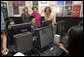 Mrs. Laura Bush and Mrs. Sehba Musharraf, wife of Pakistan's President Pervez Musharraf, right, watch a demonstration of the new cultural and arts website Thursday, Sept. 21, 2006, with students of Eleanor Roosevelt High School and teacher Elizabeth Putnam, far left, at The John F. Kennedy Center for the Performing Arts in Washington, D.C. The website is created by the Pakistan National Council the Arts and The Kennedy Center and is called, "Gift of the Indus: The Arts and Culture of Pakistan." White House photo by Shealah Craighead