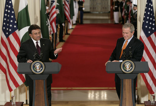 President George W. Bush listens as President Pervez Musharraf, of the Islamic Republic of Pakistan, responds to a question Friday, Sept. 22, 2006, during a joint press availability at the White House. White House photo by Eric Draper