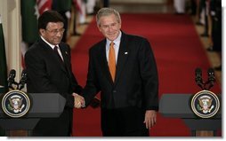 President George W. Bush and President Pervez Musharraf, of the Islamic Republic of Pakistan, shake hands after a joint press availability Friday, Sept. 22, 2006 in the East Room of the White House.  White House photo by Eric Draper