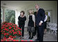 President George W. Bush and Mrs. Laura Bush are joined outside the Oval Office by the 2006 National Spelling Bee Champion, Kerry Close, as they call for Barney and Miss Beazley Friday, Sept. 22, 2006. The 9th grader from Spring Lake, N.J., won the competition by correctly spelling the word "Ursprache." White House photo by Eric Draper