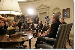 President George W. Bush addresses the media during a meeting with business leaders on Lebanon Private Sector Initiative in the Oval Office Monday, Sept. 25, 2006. Seated next to President Bush is CEO John Chambers of Cisco Systems. Participants also include Chairman Craig Barrett of Intel Corp., CEO Ray Irani of Occidental Petroleum Corp., and Chairman Yousif Ghafari of Ghafari, Inc. "Our goal, and our mission, is to help Lebanese citizens and Lebanese businesses not only recover, but to flourish, because we believe strongly in the concept of a democracy in Lebanon," said President Bush.  White House photo by Eric Draper