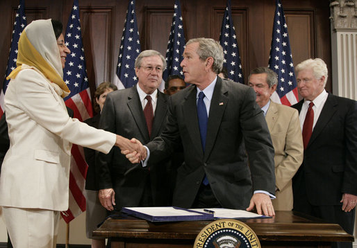 President George W. Bush shakes the hand of Ambassador Hunaina bint Sultan Al-Mughairy, of the Sultanate Oman to the United States, after signing H.R. 5684, the United States-Oman Free Trade Agreement Implementation Act Tuesday, Sept. 26, 2006, in the Dwight D. Eisenhower Executive Office Building. White House photo by Kimberlee Hewitt