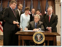 President George W. Bush signs into law S.2590, the Federal Funding Accountability and Transparency Act of 2006, Tuesday, Sept. 26, 2006, in the Dwight D. Eisenhower Executive Office Building. Looking on are Sen. Susan Collins, R-Maine, Chairwoman of the Homeland Security and Governmental Affairs Committee, and from left: Rep. Roy Blunt of Missouri, Sen. Barack Obama, D-Ill., Sen. Tom Carper, D-Del., Rep. Jeb Hensarling of Texas, and Rep. Henry Waxman of California.  White House photo by Kimberlee Hewitt