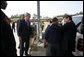 President George W. Bush observes an alternative fueling demonstration with Hoover Police Department Officer Reggie Parker, center, being embraced by Alabama Governor Bob Riley, Thursday, Sept. 28, 2006, during President Bush’s visit to the Hoover Public Safety Center in Hoover, Ala. The city has just opened an alternative fueling station to provide E85 (ethanol) and biodiesel fuels for public agency vehicles. White House photo by Paul Morse