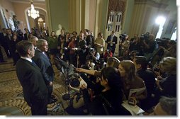 President George W. Bush stands with Senators Bill Frist, pictured in the foreground, and Mitch McConnell as he addresses the press after meeting with the Republican Senate Conference at the U. S. Capitol Thursday, Sept. 28, 2006.  White House photo by Eric Draper