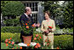 Mrs. Laura Bush smiles at Bill Williams, President and CEO of Harry & David Holdings, Monday, October 2, 2006, as she participates in a ceremony for the unveiling of the Laura Bush rose in The First Lady’s Garden at The White House. Founded in 1872, Jackson & Perkins is a leading hybridizer of garden roses and has launched The Laura Bush rose as part of the First Ladies Rose Series. The rose is a floribunda rose and has light yellow buds that open to a smoky coral color with yellow on the reverse petal. White House photo by Shealah Craighead