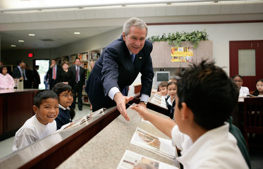  President George W. Bush greets students during a tour of the Laura Bush Library at George W. Bush Elementary School in Stockton, Calif., Tuesday, Oct. 3, 2006. White House photo by Eric Draper