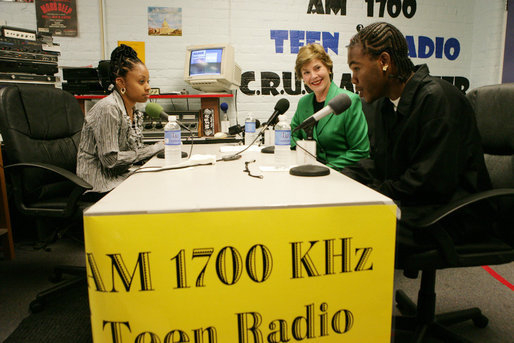 Mrs. Laura Bush participates in a radio interview with Amber Bellamy, age 17, left, and Elliott White, Jr., age 22, Wednesday, October 4, 2006, during a visit to the Children’s Training Network/AM 1700 Radio Program in Buffalo, New York, as part of the President’s Helping America’s Youth initiative. Together with Crucial Human Service Center and other Buffalo community programs, AM 1700 Station encourages caring adults to connect as mentors with high-risk youth. White House photo by Shealah Craighead