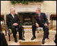 President George W. Bush meets with American Legion National Commander Paul Morin of Chicopee, Mass., in the Oval Office at the White House, Thursday, Oct. 5, 2006. White House photo by Eric Draper