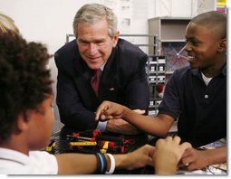 President George W. Bush talks with students during his visit Thursday, Oct. 5, 2006, in the SmartLab of the Woodridge Elementary and Middle Campus in Washington, D.C., where students demonstrated various math, science and technology projects.  White House photo by Paul Morse