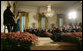 President George W. Bush is joined by Spain's Crown Prince Felipe de Borbon y Grecia, seated left, as they applaud the performance of singer Ana Cristina and guitarist Marco Linares, Friday, Oct. 6, 2006, in the East Room of the White House, in celebration of Hispanic Heritage Month. White House photo by Kimberlee Hewitt