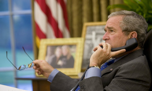 President George W. Bush speaks on the phone with Senegalese President Abdoulaye Wade in the Oval Office Friday, Oct. 6, 2006, about the current crisis in Darfur. White House photo by Eric Draper