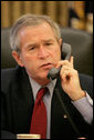 President George W. Bush speaks with Chinese President Hu Jintao from the Oval Office, Monday, Oct. 9, 2006. White House photo by Eric Draper