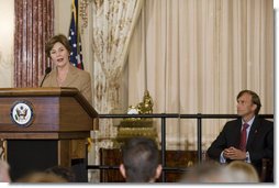 Newly sworn-in Ambassador Mark Dybul, Coordinator of the Office of the US Global AIDS, looks at Mrs. Laura Bush as she speaks to an audience of Ambassadors to the United States, government officials, representatives from the public health sector and Non-Governmental Organizations Tuesday, October 10, 2006, during the swearing-in ceremony of Ambassador Mark Dybul in the Benjamin Franklin Room at the U.S. Department of State in Washington, D.C. Ambassador Dybul will coordinate and oversee the U.S. global response to HIV/AIDS, and lead implementations of the U.S. President's Emergency Plan for AIDS Relief (Emergency Plan/PEPFAR), the largest commitment ever by any nation for an international health initiative dedicated to a single disease.  White House photo by Shealah Craighead