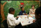 Mrs. Laura Bush sculpts clay with participants of the Communications Through Art program at the Knox County Public Defenders Community Law Office in Knoxville, Tennessee, Wednesday, October 11, 2006, as part of the President’s Helping America’s Youth program. Communications Through Art program uses the arts to help young people express themselves and to deal with important issues of the day. White House photo by Shealah Craighead