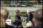 Mrs. Laura Bush shakes hands with Andy Taylor, chairman and CEO of Enterprise Rent-A-Car, following her remarks Thursday, October 11, 2006, during a tree planting ceremony for the Enterprise 50 Million Tree Pledge in St. Louis, Missouri. White House photo by Shealah Craighead