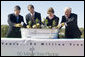 Mrs. Laura Bush is joined by, from left, U.S. Department of Agriculture Secretary Mike Johanns; John Rosenow, president of the National Arbor Day Foundation, and Andy Taylor, chairman and CEO of Enterprise Rent-A-Car, as they plant White Pine saplings Thursday, October 11, 2006, during a ceremony for the Enterprise 50 Million Tree Pledge in St. Louis, Missouri. Enterprise Rent-A-Car donated $50 million to the National Arbor Day Foundation to plant 50 million trees in National Forests over the next 50 years. The White Pine saplings planted at the ceremony will be re-planted permanently in the Mark Twain National Forest in southern Missouri. White House photo by Shealah Craighead