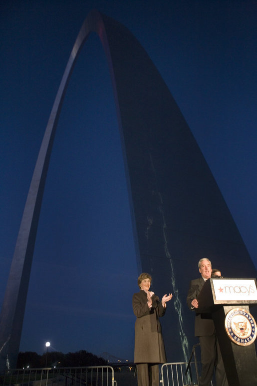 Mrs. Laura Bush applauds Chairman and CEO William McNamara of Macy's Midwest, as he delivers welcoming remarks during the Arch Lighting for Breast Cancer Awareness event in Thursday, Oct. 12, 2006, in St. Louis. The Gateway Arch was illuminated in pink in honor of Breast Cancer Awareness Month. White House photo by Shealah Craighead