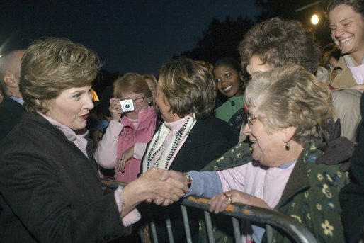 Mrs. Laura Bush greets members of the audience members that include representatives from breast cancer organizations, supporters of breast cancer research, breast cancer survivors and local residents during the Arch Lighting for Breast Cancer Awareness Thursday, Oct. 12, 2006, in St. Louis. White House photo by Shealah Craighead