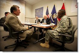 Vice President Dick Cheney speaks with Brigadier General Robert Crear, Commander of the Mississippi Valley Division of the U.S. Army Corps of Engineers, during a briefing on Hurricane Katrina recovery held at the New Orleans Port Authority in New Orleans, La., Thursday, October 12, 2006. The U.S. Army Corps of Engineers has been working to address flood problems along the Mississippi River since the 1800's and is responsible for rebuilding the 169 miles of levees in the southeast Louisiana area that sustained damage as a result of Katrina. White House photo by David Bohrer