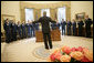 President George W. Bush gestures as he speaks to the U.S. Air Force Thunderbirds during their visit to the Oval Office, Friday, Oct. 13, 2006. The Thunderbirds are scheduled to perform a fly over for the opening of the Air Force Memorial in Arlington, Va., Saturday, Oct. 14, 2006. White House photo by Eric Draper