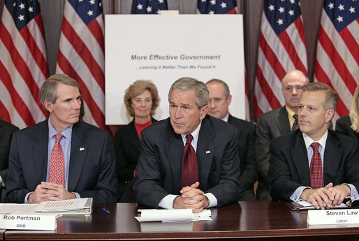 President George W. Bush addresses members of the President’s Management Council, Friday, Oct. 13, 2006, in a meeting at the Eisenhower Executive Office Building in Washington, D.C. Pictured with the President are OMB Director Rob Portman, left, and Labor Deputy Secretary Steven Law. The council met to discuss the President’s Management Agenda accomplishments, which will be summarized in a government-wide report to Federal employees and Congress on the state of the government’s management practices. White House photo by Eric Draper