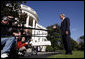 President George W. Bush comments on the passing of a resolution by the United Nations concerning the actions of North Korea before departing the White House on October 14, 2006. White House photo by Paul Morse