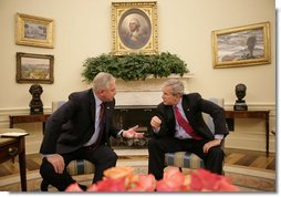 President George W. Bush and the Prime Minister of the Republic of Croatia H.E. Ivo Sanader talk together in the Oval Office at the White House, Tuesday, Oct. 17, 2006. White House photo by Eric Draper