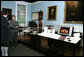 Mrs. Laura Bush listens to David Temple, actor portraying Benjamin Franklin, Wednesday, October 18, 2006, as he guides her through the Benjamin Franklin: In Search of a Better World Exhibit, at the Houston Museum of Natural Science in Houston, Texas. The exhibition, a blend of art, history, science, and material culture, features Franklin's original possessions, including many items never publicly displayed, iconic works of art and rare documents. It also features interactive devices that enable visitors to explore Franklin's eighteenth-century world using twenty-first-century technology. White House photo by Shealah Craighead