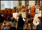 A little reader takes a closer look as Mrs. Laura Bush reads the children's book, "I Love You, Little One," by Nancy Tafuri during a visit to the Jenna Welch and Laura Bush Community Library in El Paso, Texas, Wednesday, Oct. 18, 2006. Since the library opened in 2003, the number of programs and attendance has tripled. Through the past year, the Library hosted 349 programs for more than 10,000 participants. White House photo by Shealah Craighead