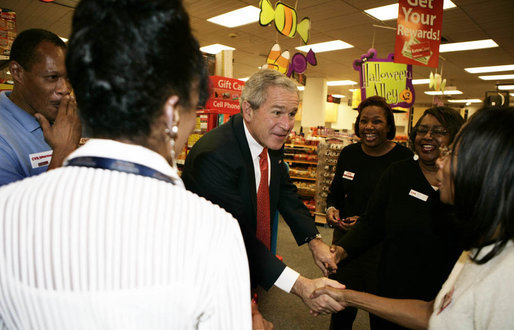 President George W. Bush meets employees at a pharmacy in Washington, D.C. Friday, Oct. 20, 2006, during a visit to the store where he talked about the Medicare Part D Plan. "Our seniors are saving money, they're getting better coverage," said the President. "It's a plan that I'm real proud of." White House photo by Kimberlee Hewitt