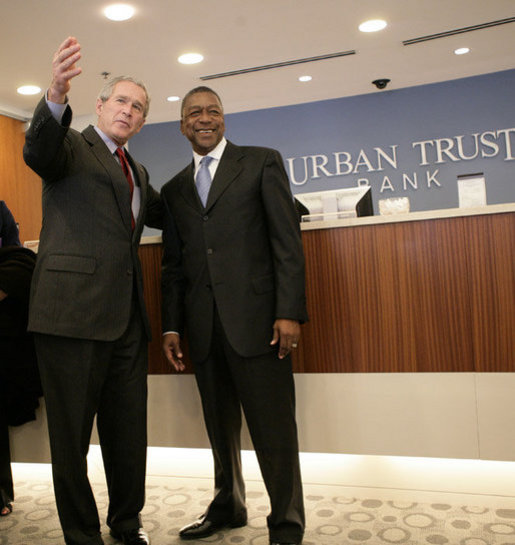 President George W. Bush is welcomed by Bob Johnson, founder and chairman of the RLJ Companies, to the Urban Trust Bank for a discussion on the economy with small business owners and community bankers, Monday, Oct. 23, 2006 in Washington, D.C. White House photo by Eric Draper