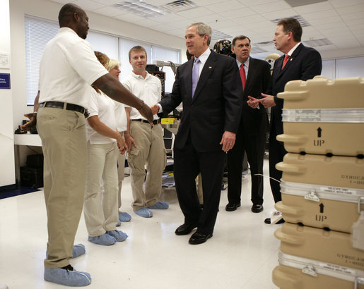 President George W. Bush shakes hands with employees at Gyrocam Systems in Sarasota, Fla., Tuesday, Oct. 24, 2006, during a visit that highlighted technology to help soldiers fight the war on terrorism. White House photo by Eric Draper