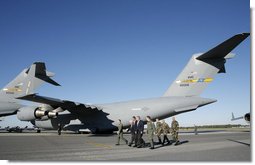 President George W. Bush walks past C-17 aircraft before addressing military personnel and their families at Charleston Air Force Base in Charleston, South Carolina on Saturday, October 28, 2006. White House photo by Paul Morse