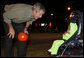 President George W. Bush greets a trick-or-treating frog Tuesday, Oct. 31, 2006, during an unscheduled stop on base at Robins Air Force Base in Warner Robins, Ga. White House photo by Paul Morse