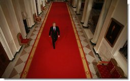 President George W. Bush walks through Cross Hall en route to the East Room of the White House Wednesday, Nov. 8, 2006, from where he spoke to the nation regarding Tuesday's election. White House photo by Paul Morse