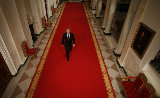 President George W. Bush walks through Cross Hall en route to the East Room of the White House Wednesday, Nov. 8, 2006, from where he spoke to the nation regarding Tuesday's election. White House photo by Paul Morse