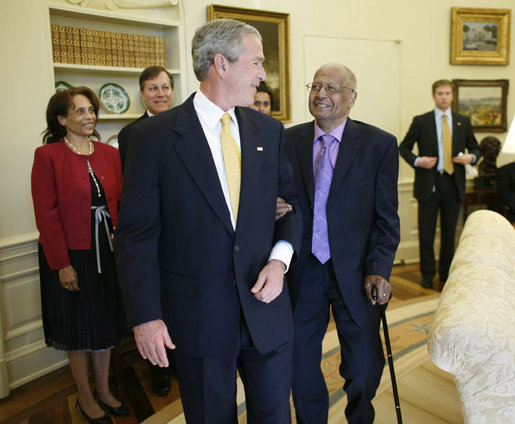 President George W. Bush escorts National Endowment of the Arts 2006 Medal of Arts recipient, photographer Roy DeCarava, into the Oval Office Thursday, Nov., 9, 2006 for the presentation ceremony to recognize outstanding individuals for their excellence and contribution to the arts in America. White House photo by Paul Morse