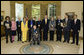 President George W. Bush and Mrs. Laura Bush stand with the recipients of the 2006 National Medal of Arts in the Oval Office Thursday, Nov., 9, 2006. Pictured from left, they are: Ben Jaffe and his mother Sandra Jaffe, director and co-founder of the Preservation Hall Jazz Band; Literary Translator Gregory Rabassa; Dancer Cyd Charisse; Photographer Roy DeCarava; Industrial Designer Viktor Schreckengost; Musician Dr. Ralph Stanley; Arts patron Billie Holladay; Composer William Bolcom; Interlochen Center for the Arts CEO Jeffrey Kimpton; and NEA Chairman Dana Gioia. White House photo by Paul Morse