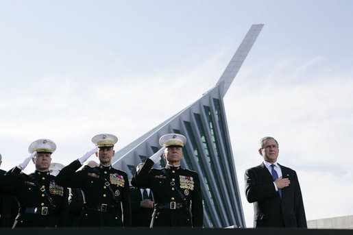 President George W. Bush joins, from left, U.S. Marine Corps Lt. Gen. James Amos; Chairman of the Joint Chiefs of Staff General Peter Pace and Commandant of the Marine Corps, General Michael Hagee, during the National Anthem at the dedication ceremony of the National Museum of the Marine Corps Friday, Nov. 10, 2006, in Quantico, Va. White House photo by Paul Morse