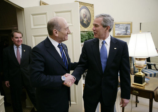 President George W. Bush welcomes Israeli Prime Minister Ehud Olmert to the White House for a meeting Monday, Nov. 13, 2006. White House photo by Eric Draper