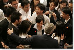 President George W. Bush greets students after delivering remarks Thursday, Nov. 16, 2006, at the National University of Singapore. White House photo by Paul Morse