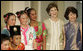 Mrs. Laura Bush stands with Jenny Law, principal of the Bukit View Primary School in Singapore, as they pose with student members of the Bukit View Primary School dance troupe Thursday, Nov. 16, 2006. The kids performed for President George W. Bush and Mrs. Bush during a visit Thursday morning to the Asian Civilisations Museum. White House photo by Paul Morse