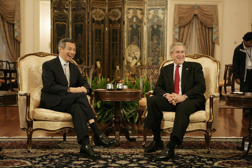 President George W. Bush and Prime Minister Lee Hsien Loong of Singapore, smile for the cameras Thursday, Nov. 16, 2006, during a visit by President Bush to Istana, the presidential palace, in Singapore. The two had "a wide-ranging discussion," according to the President, during which they discussed economics and terrorism. White House photo by Eric Draper