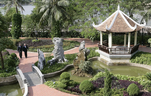 President George W. Bush and Prime Minister John Howard of Australia, walk through the courtyard of the Sheraton Hanoi Hotel Friday, Nov. 17, 2006. The pair met for lunch and talked about a number of subjects including global terrorism, the U.S. elections and global warming. White House photo by Eric Draper