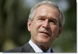 President George W. Bush smiles during a press availability Friday, Nov. 17, 2006, with Australian Prime Minister John Howard at the Sheraton Hanoi Hotel. White House photo by Paul Morse