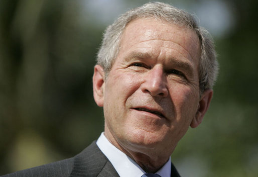 President George W. Bush smiles during a press availability Friday, Nov. 17, 2006, with Australian Prime Minister John Howard at the Sheraton Hanoi Hotel. White House photo by Paul Morse